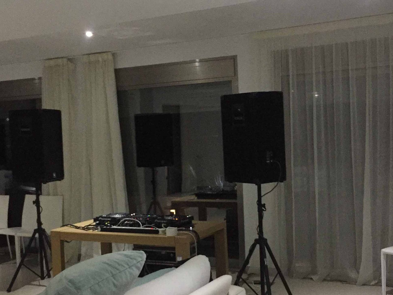 Speakers set up in a white villa living room